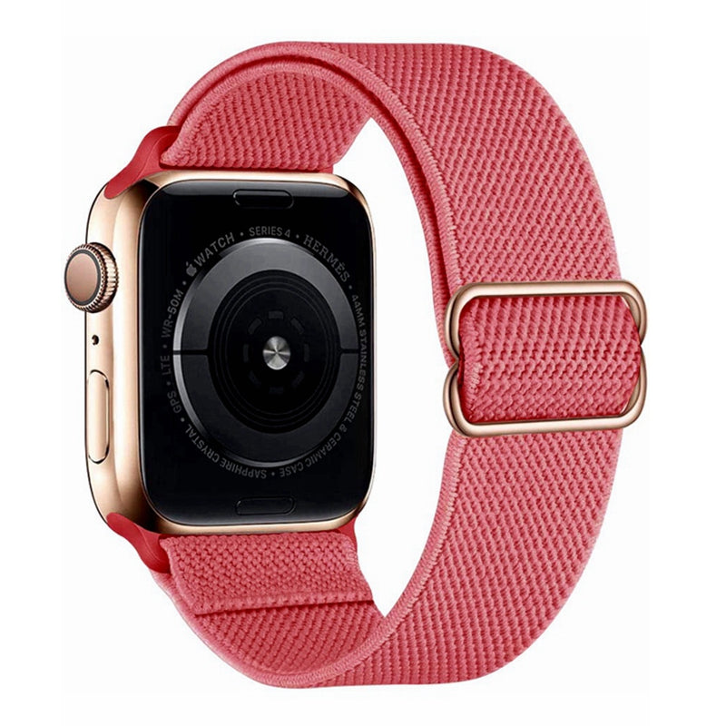 Gold Apple Watch Series 4 with pink woven elastic loop band and adjustable buckle closure