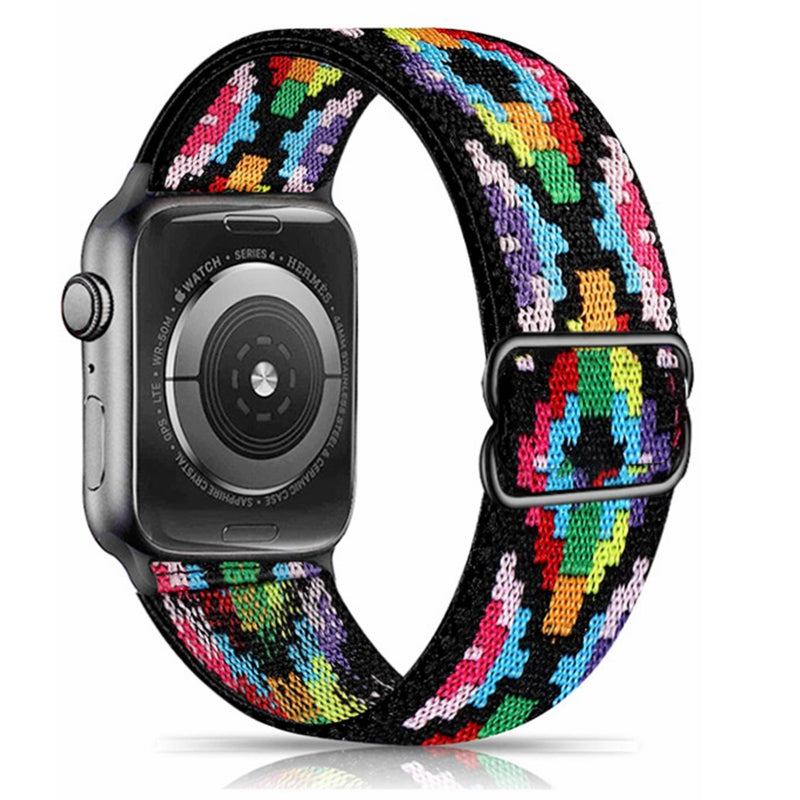 Apple Watch Series 9 with colorful houndstooth woven elastic loop band in rainbow pattern
