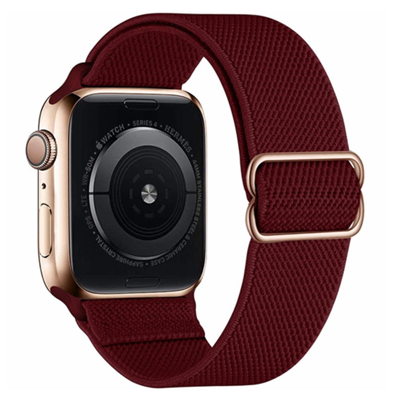 Gold stainless steel smartwatch with dark burgundy woven elastic loop band and adjustable buckle closure