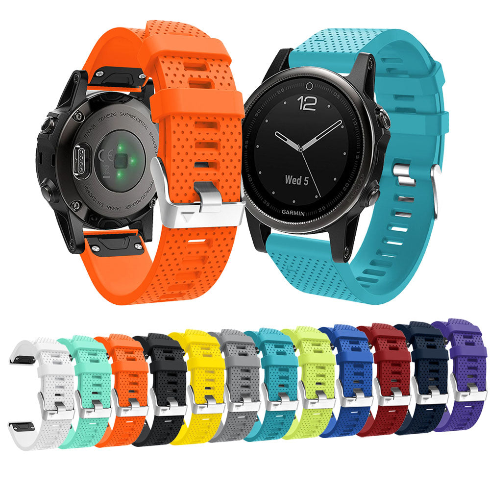 Garmin smartwatch with interchangeable silicone watch bands in multiple colors including orange, turquoise, yellow, black, and purple