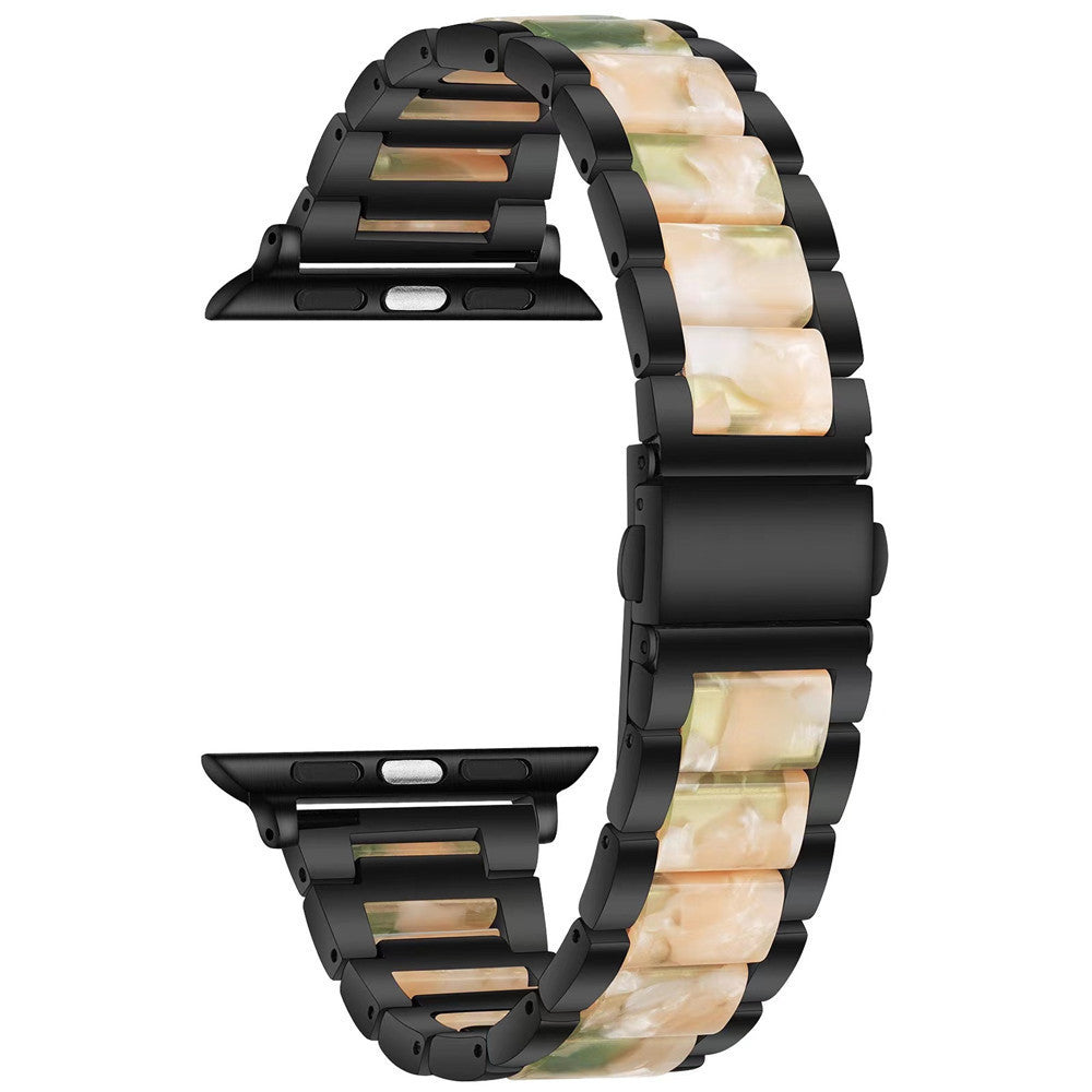 Black and pearlescent resin Apple Watch band with alternating link design in cream and green marble pattern