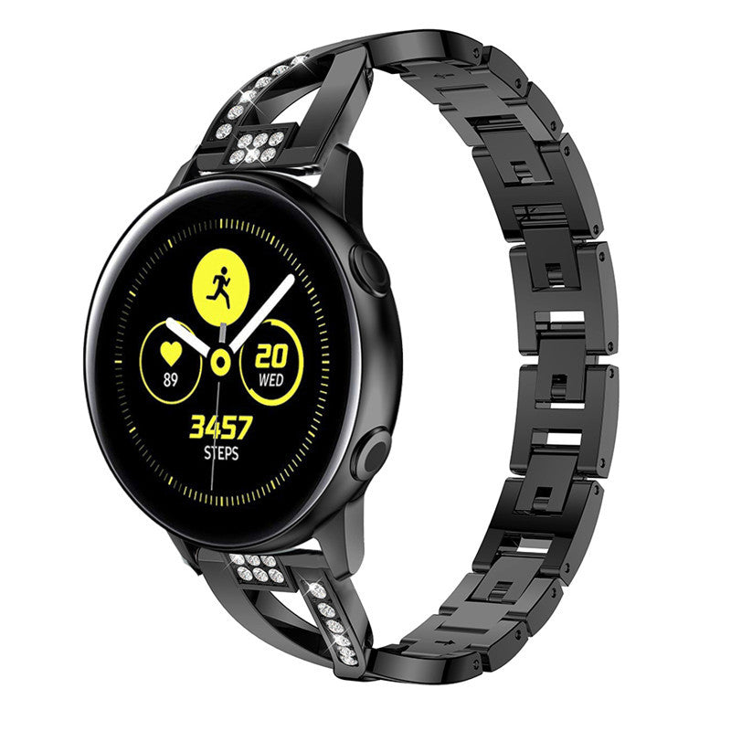 Black smartwatch with AMOLED display showing fitness metrics, matching black stainless steel quick-release bracelet with crystal accents