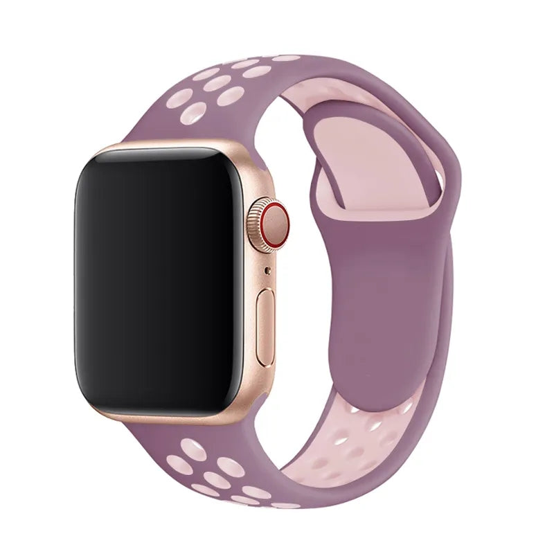 Gold Apple Watch with mauve and pink perforated silicone sport band