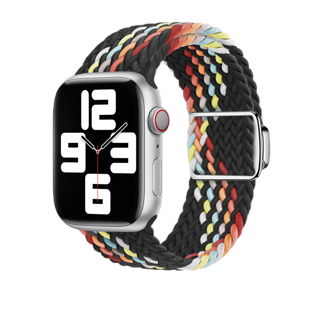 Silver smartwatch with colorful braided fabric loop band featuring red, yellow, orange, and blue stripes on black base with magnetic clasp
