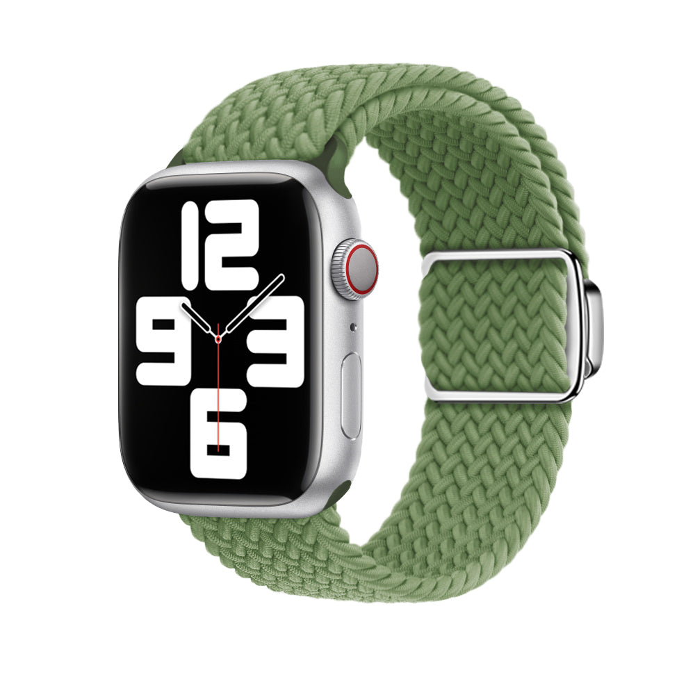 Silver smartwatch with green braided loop band and magnetic clasp, displaying time on black face