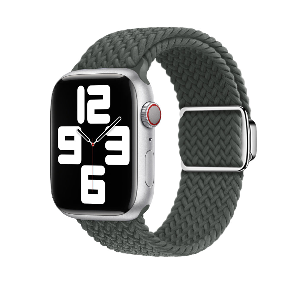 Silver smartwatch with dark green braided loop band and magnetic clasp, displaying time on black dial face