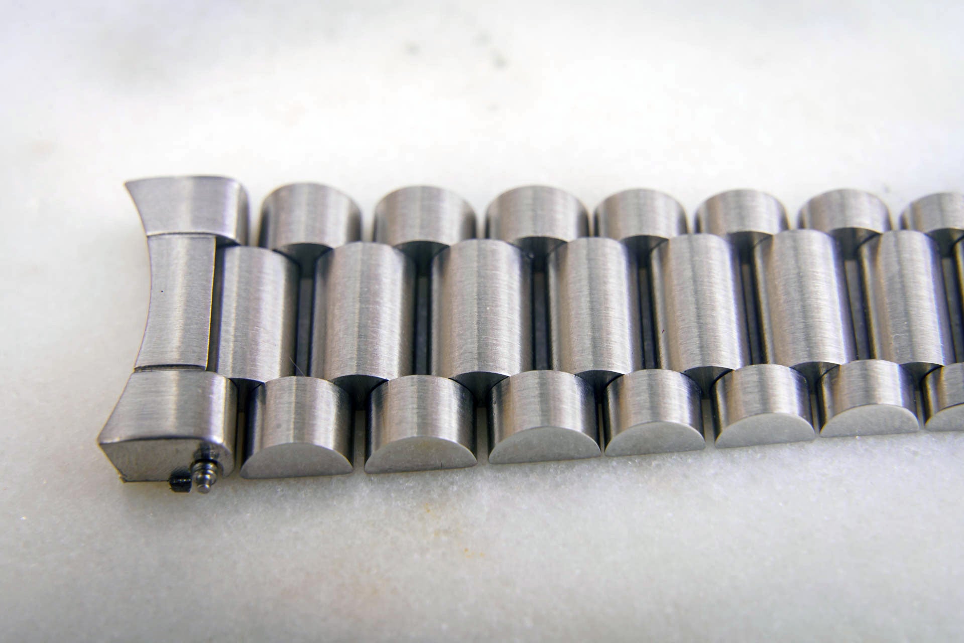 Stainless steel three-row watch bracelet with curved end link for Omega Speedmaster 20mm, polished and brushed metal finish
