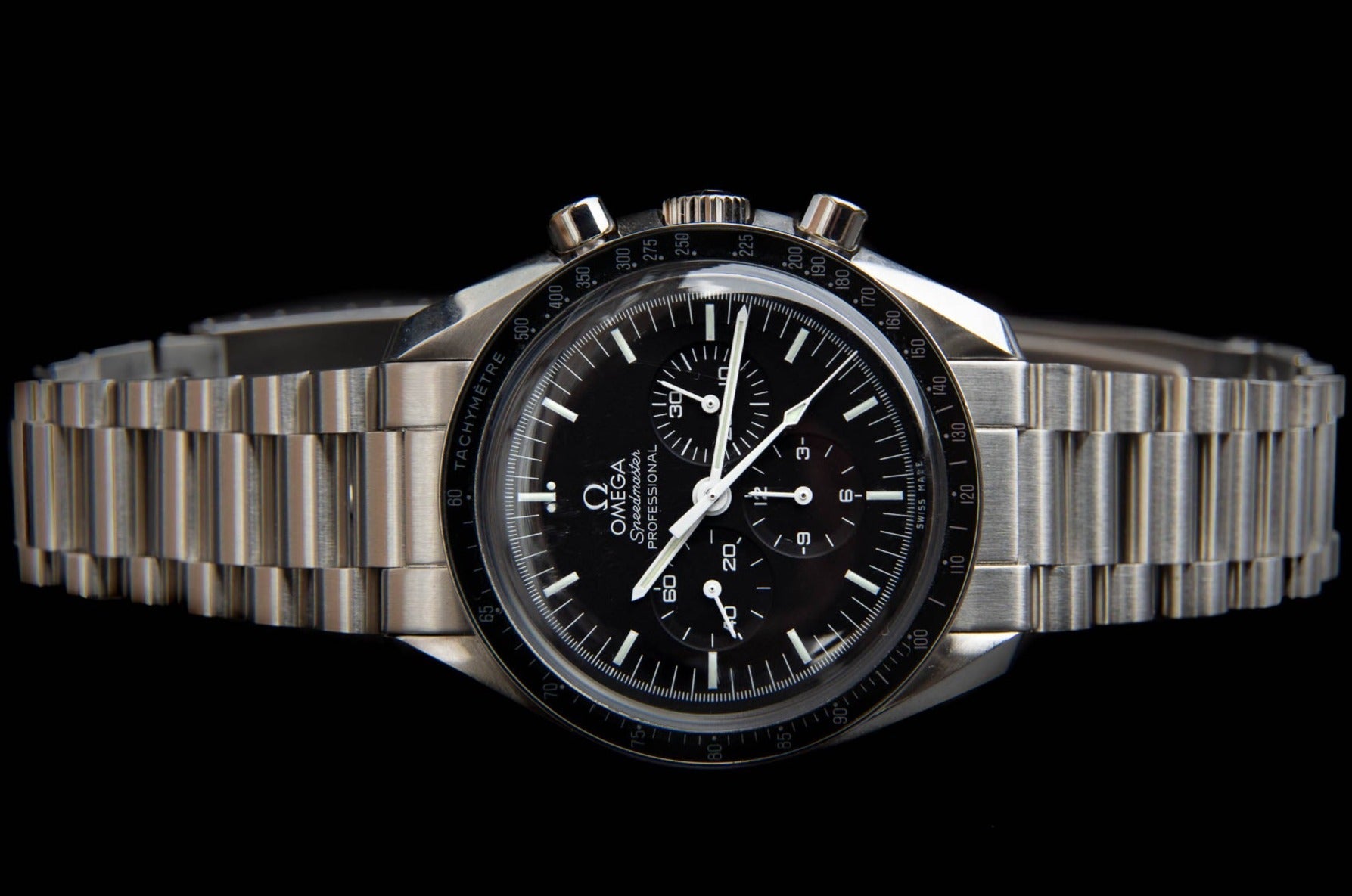 Omega Speedmaster Professional chronograph watch with stainless steel bracelet, black dial, and tachymeter bezel