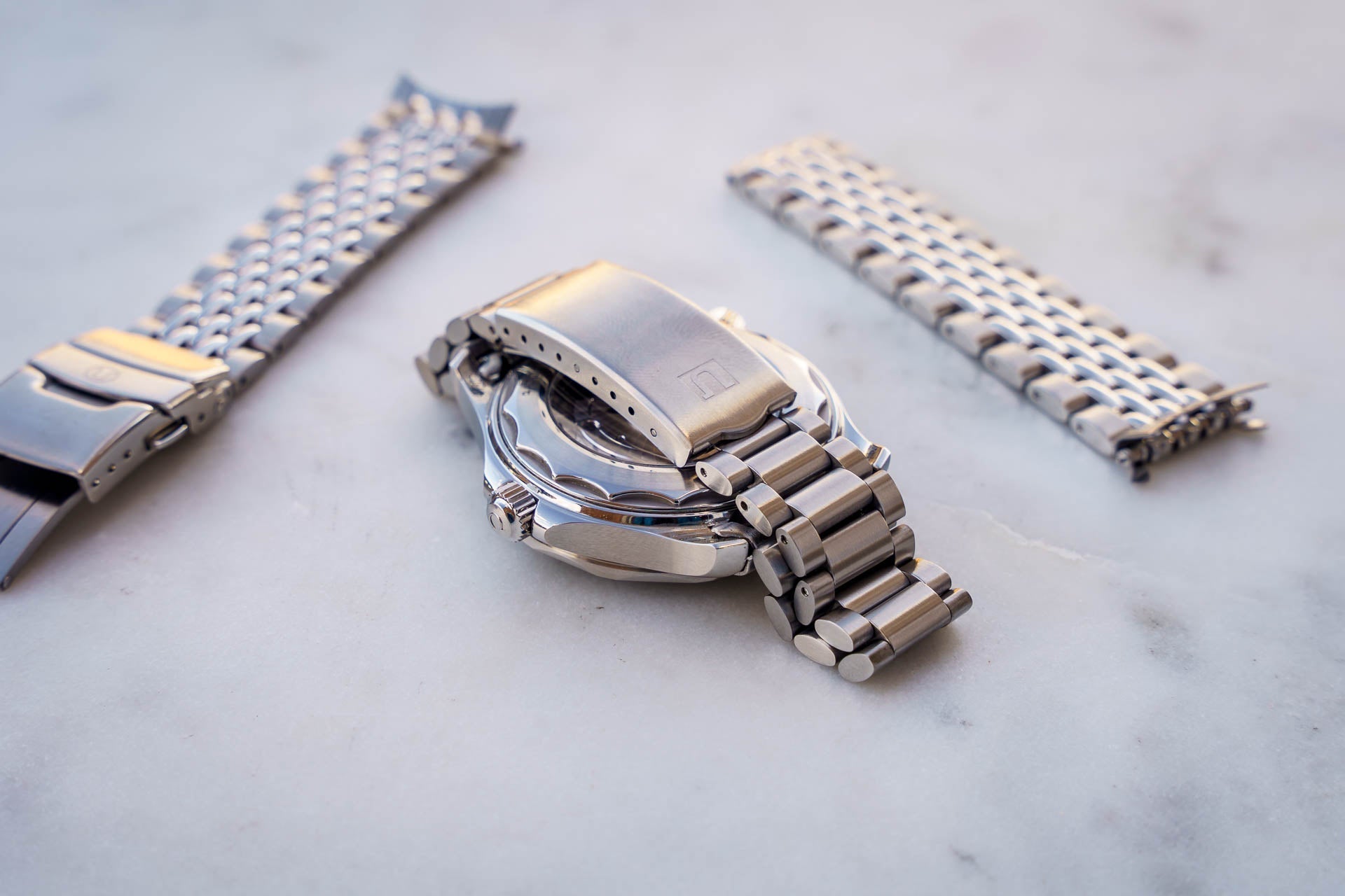 Stainless steel bracelet for Omega Seamaster 300m dive watch with solid links and deployment clasp