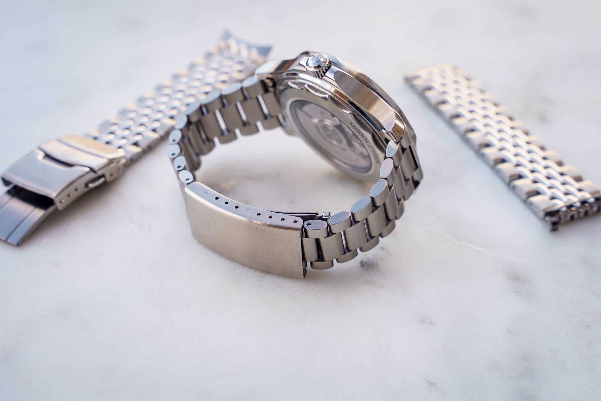 Stainless steel bracelet for Omega Seamaster 300m watch with solid metal links and secure clasp closure