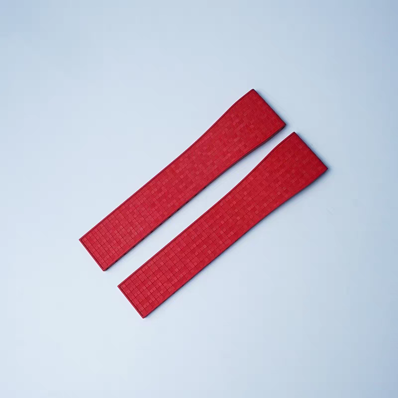 Red rubber watch strap pair with textured mosaic pattern and quick release spring bars, 16mm width