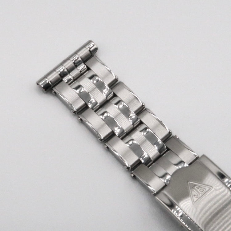 Silver-tone 5-link rivet bracelet with polished metal links and adjustable sizing, displayed on white background