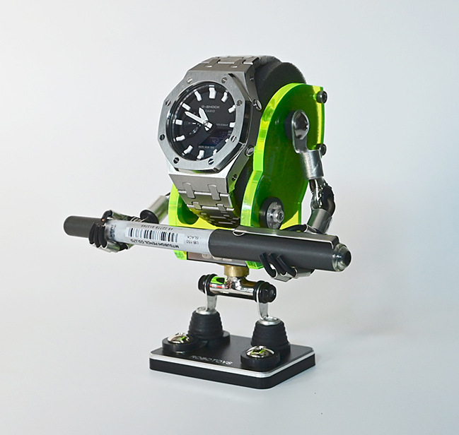 Neon green and black Minibot robot watch stand holding silver analog watch and telescope on black base