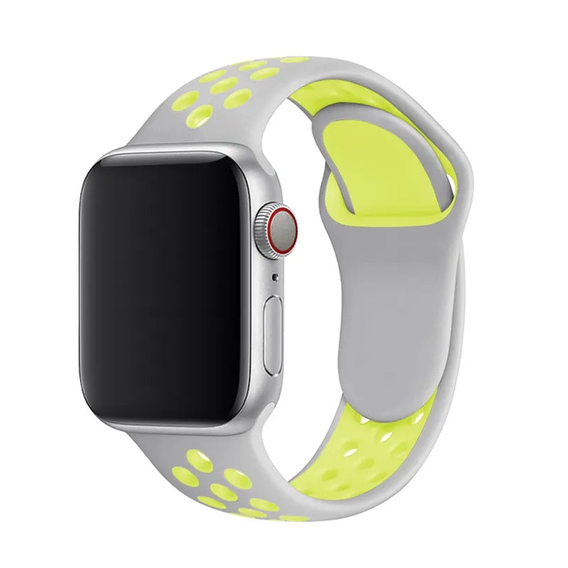 Silver aluminum Apple Watch with gray and neon yellow sports silicone band featuring ventilation holes