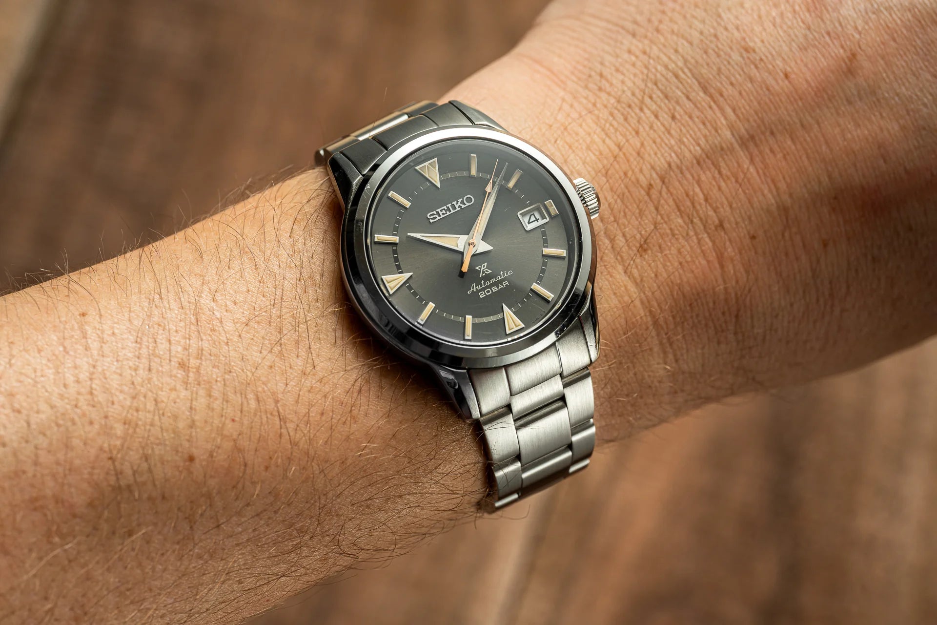 Seiko Prospex Alpinist automatic watch with charcoal dial and stainless steel bracelet on wrist
