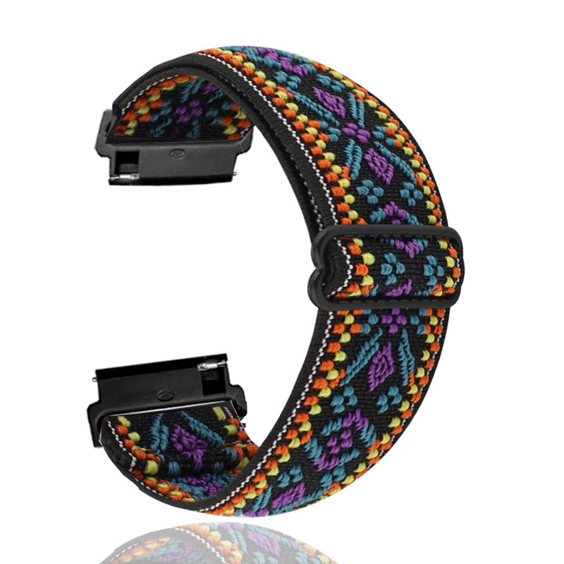 Colorful woven elastic smartwatch band with quick release black hardware, featuring multicolor geometric pattern in purple, blue, orange and black