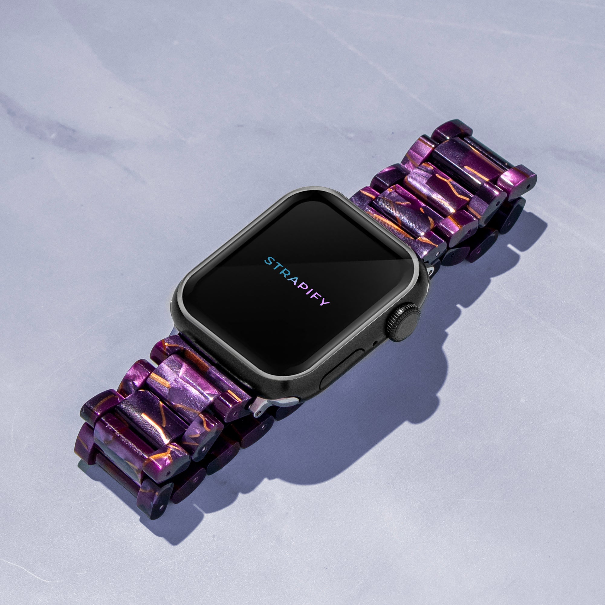 Strapify purple crystallized acetate smartwatch band with metallic accents on black Apple Watch display