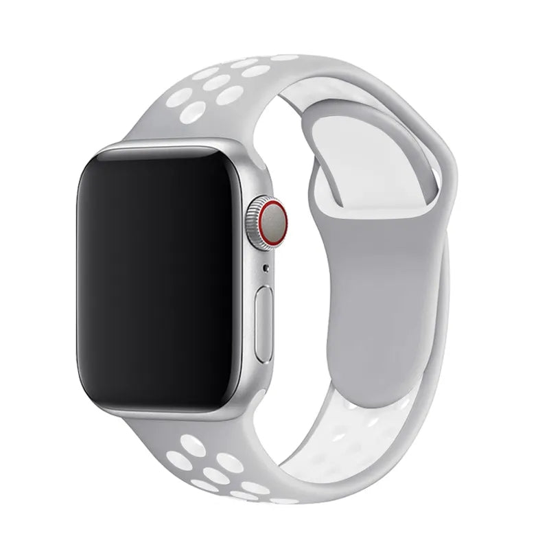 Silver aluminum smartwatch with gray and white perforated silicone sport band and red digital crown