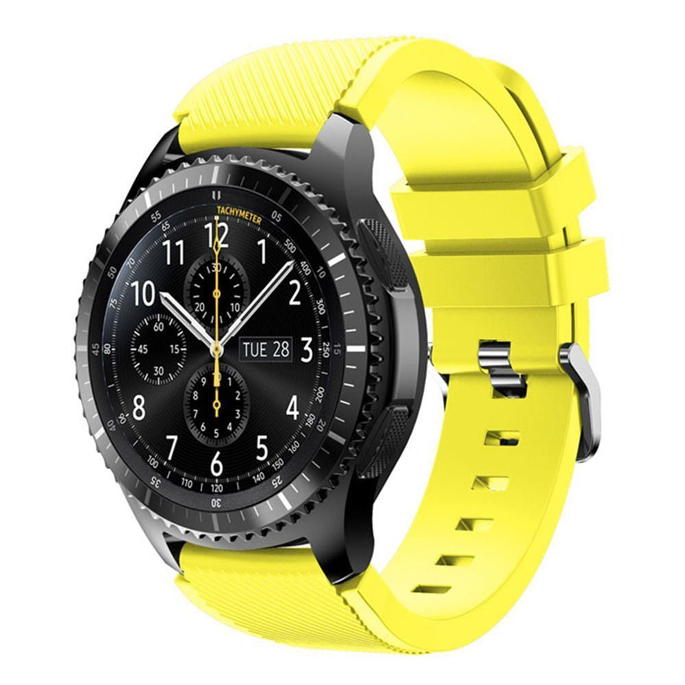 Black smartwatch with tachymeter bezel and yellow silicone sport band, displaying chronograph dial and date window
