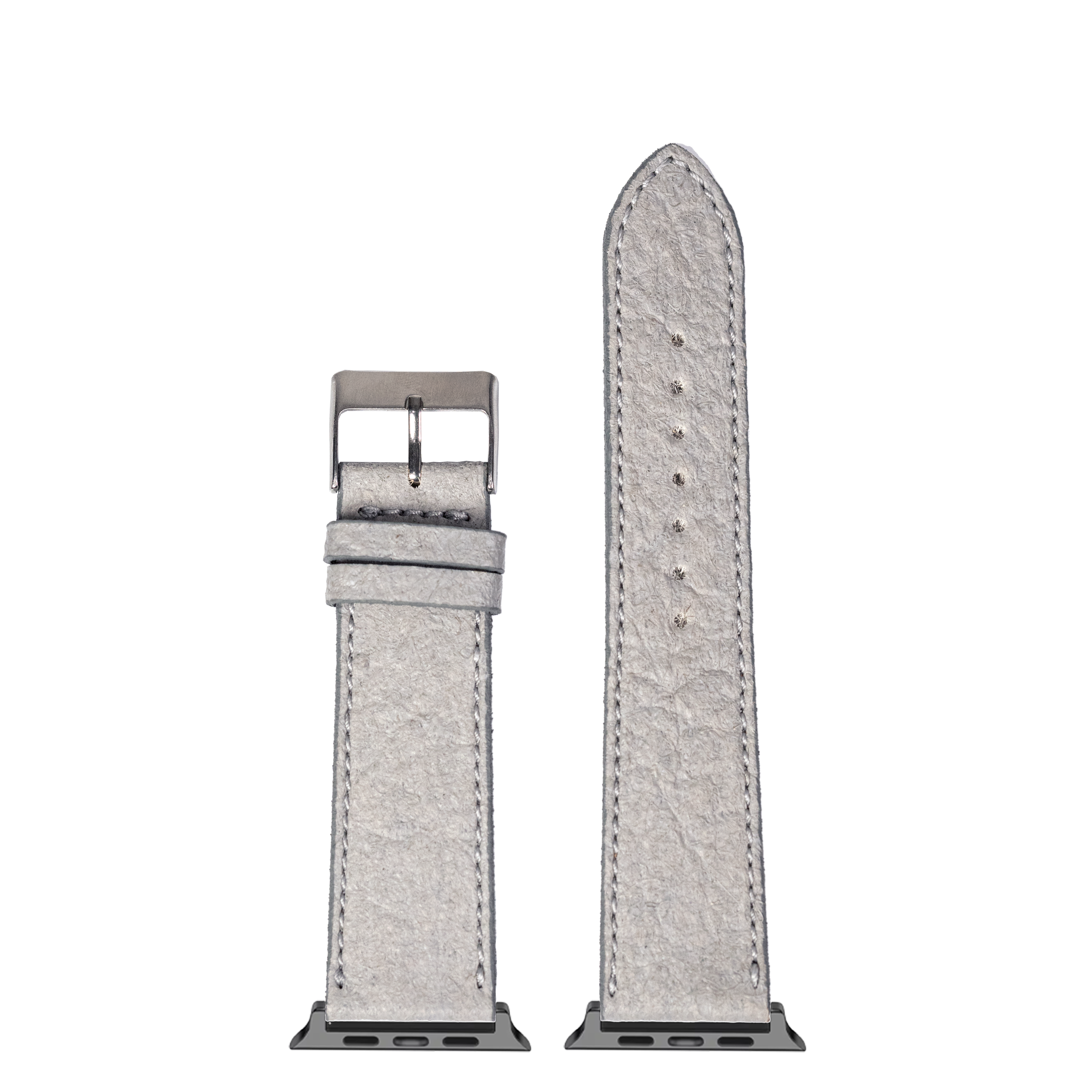 Grey pineapple vegan leather Apple Watch band with white stitching and gunmetal buckle, shown with connector adapters