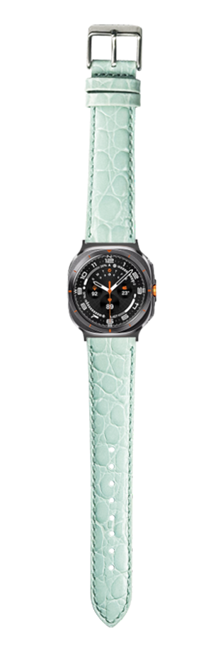 Mint green alligator leather watch band with black sports watch face and orange accents