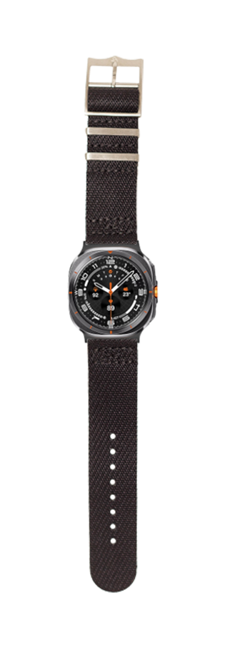Black fabric sport watch with dark gray case, orange accents, and extended black textile strap featuring adjustable buckle closure