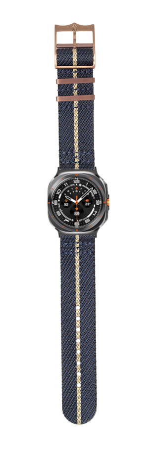 Galaxy Watch 8 Ultra smartwatch with dark blue and wheat stripe fabric band and bronze hardware on white background