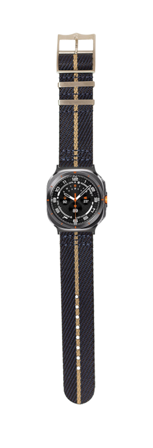 Black dial sport watch with tan fabric strap and tan buckle featuring orange accents and numeric markers