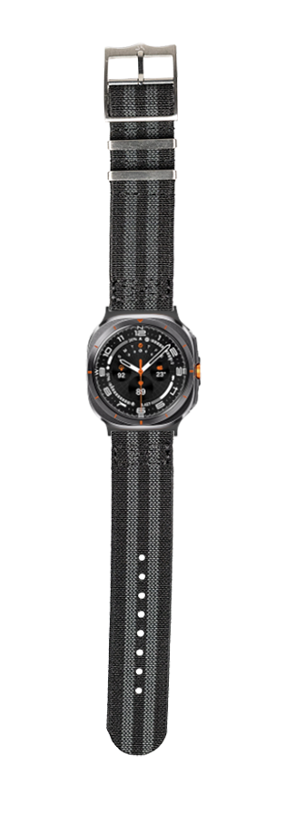 Black sports watch with orange accents and black fabric strap, featuring analog dial and metal buckle