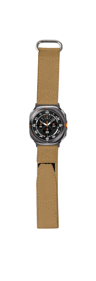 Military-style smartwatch with black dial and orange accents on tan canvas velcro strap, tactical design