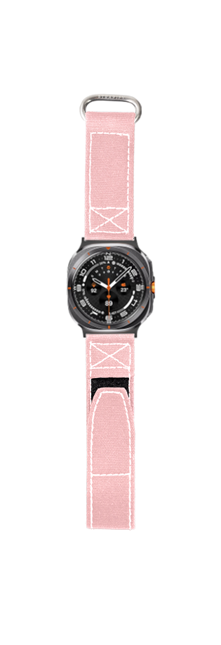 Black sports watch with pink canvas Velcro band featuring white stitching and metal buckle