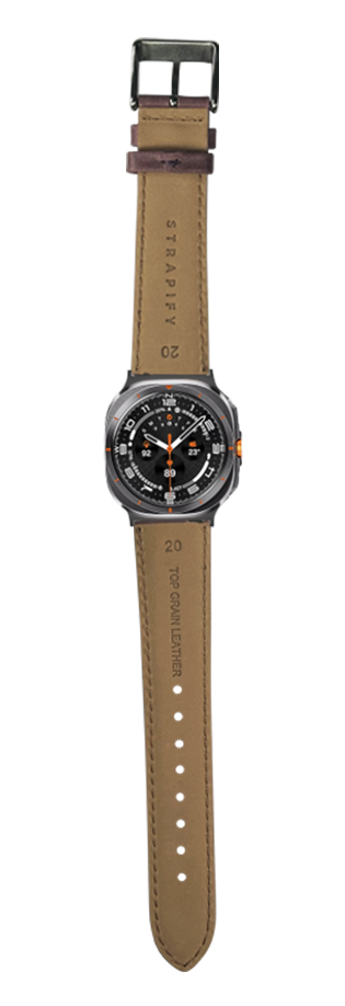 Padded leather watch strap in mauve with gunmetal buckle and orange accents, displayed on timepiece