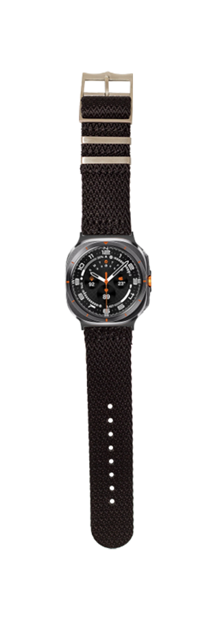 Black fabric smartwatch band with gunmetal case, orange accents, and taupe buckle on black textile strap