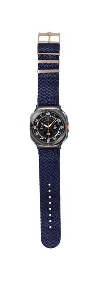 Navy blue canvas military watch with black dial, orange accents, and tan buckle strap