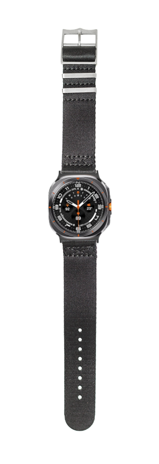Black tactical watch with dark fabric strap, digital display, and orange accents on black dial face