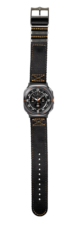 Black canvas watch with orange stitching, dark gray case, black dial, orange accents, and metal buckle closure