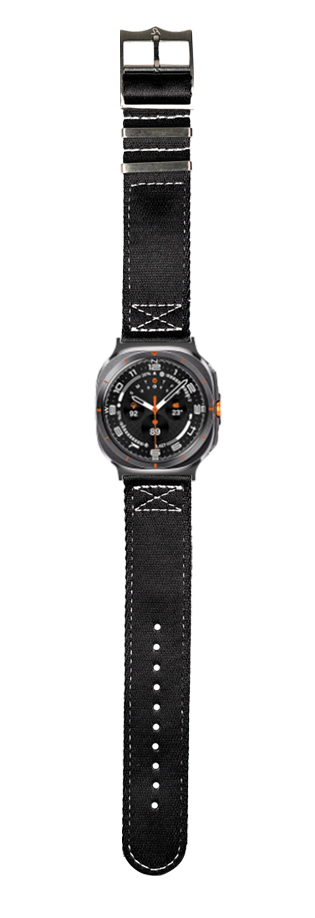 Black tactical watch with orange accents, white stitched canvas band, and metal buckle fastener