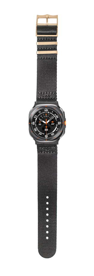 Black fabric military watch with rose gold hardware, orange accents, and adjustable canvas band