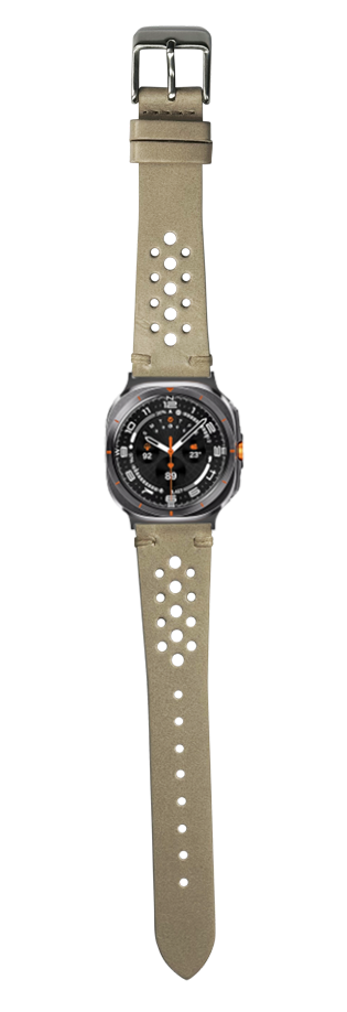 Vintage Rally cream leather watch band with perforated design and gunmetal buckle on black sports watch face with orange accents