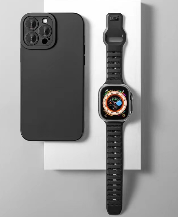 Black ridged sports rubber Apple Watch band with adjustable strap and sport smartwatch displaying compass dial face