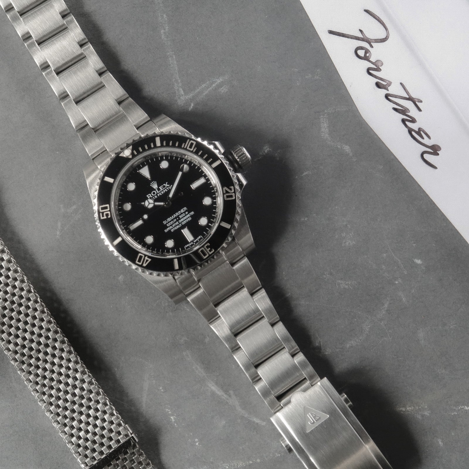 Stainless steel bracelet with solid end links for Rolex dive watch professional series, 20mm width, flat lay display