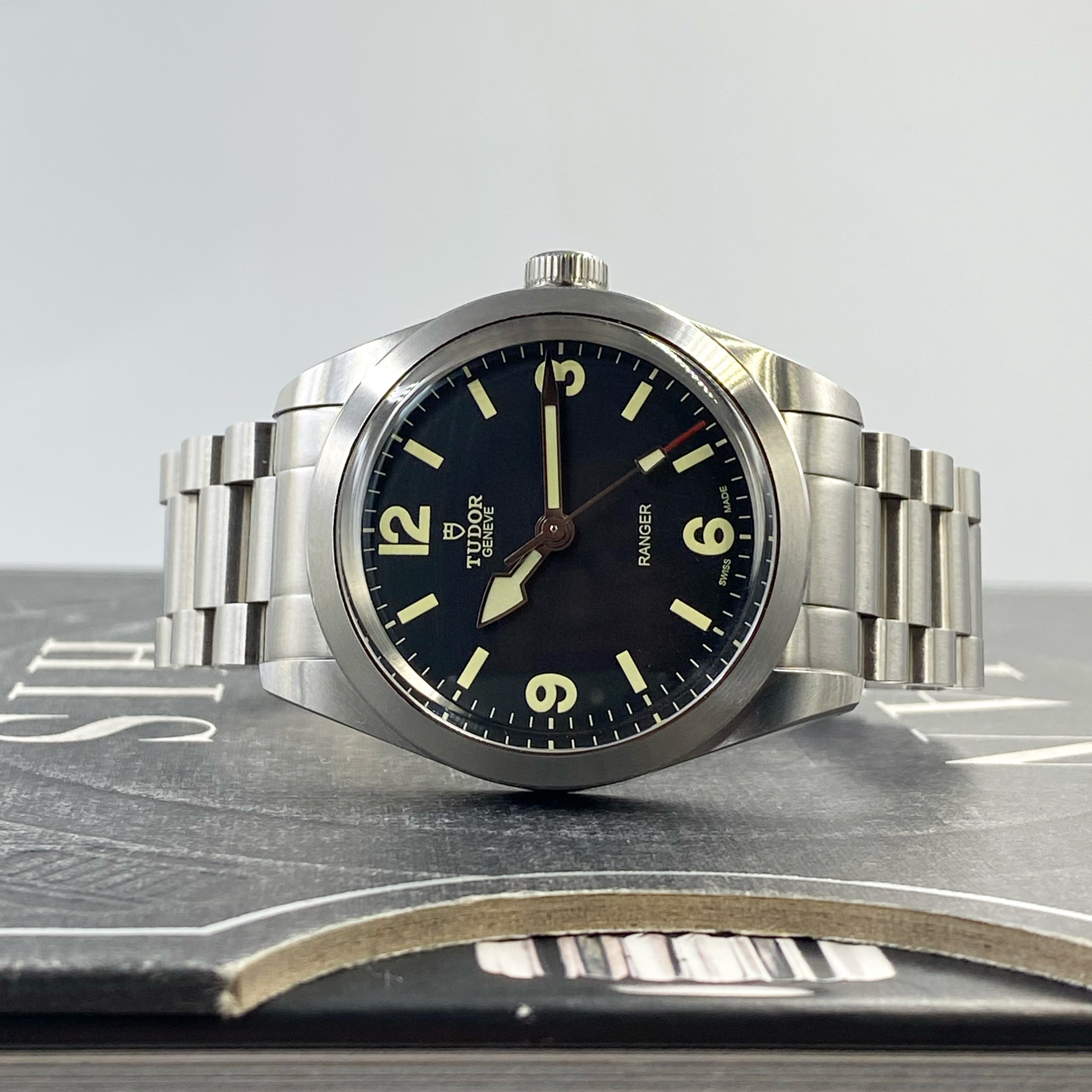 Tudor Ranger 39 stainless steel watch with black dial, luminous hour markers, and matching metal bracelet