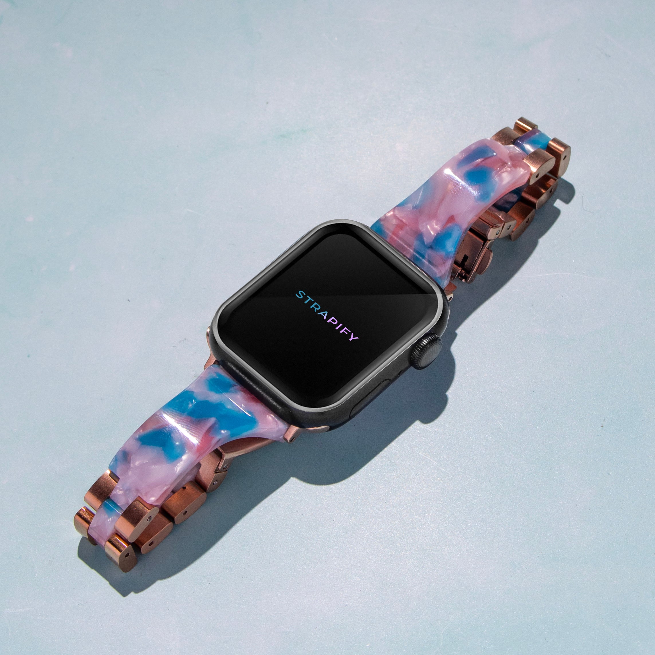 Strapify acetate bangle smartwatch band in blue pearl with rose gold hardware on square face watch