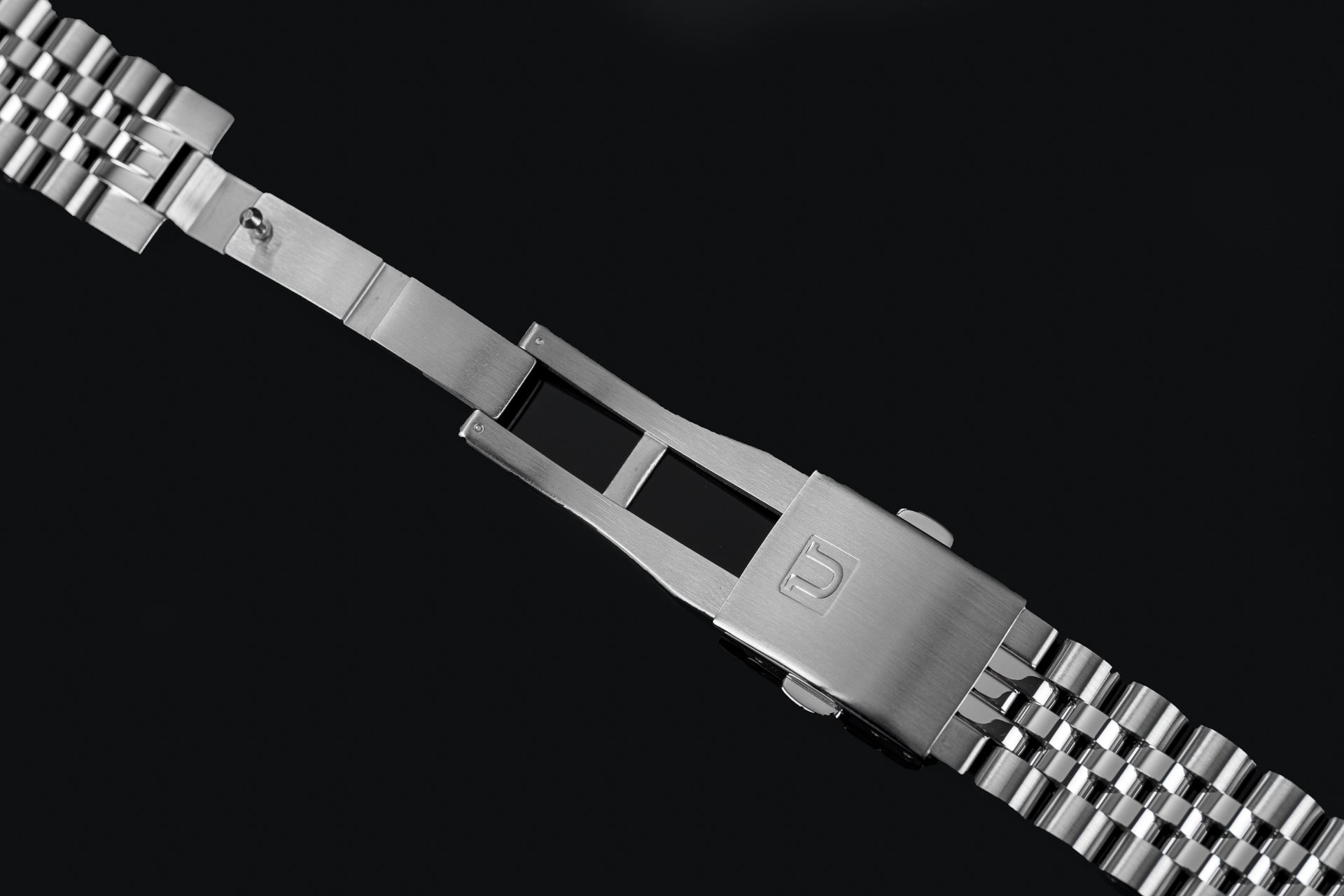 Stainless steel Uncle Executive bracelet with adjustable links for Seiko SRPK watches on black background