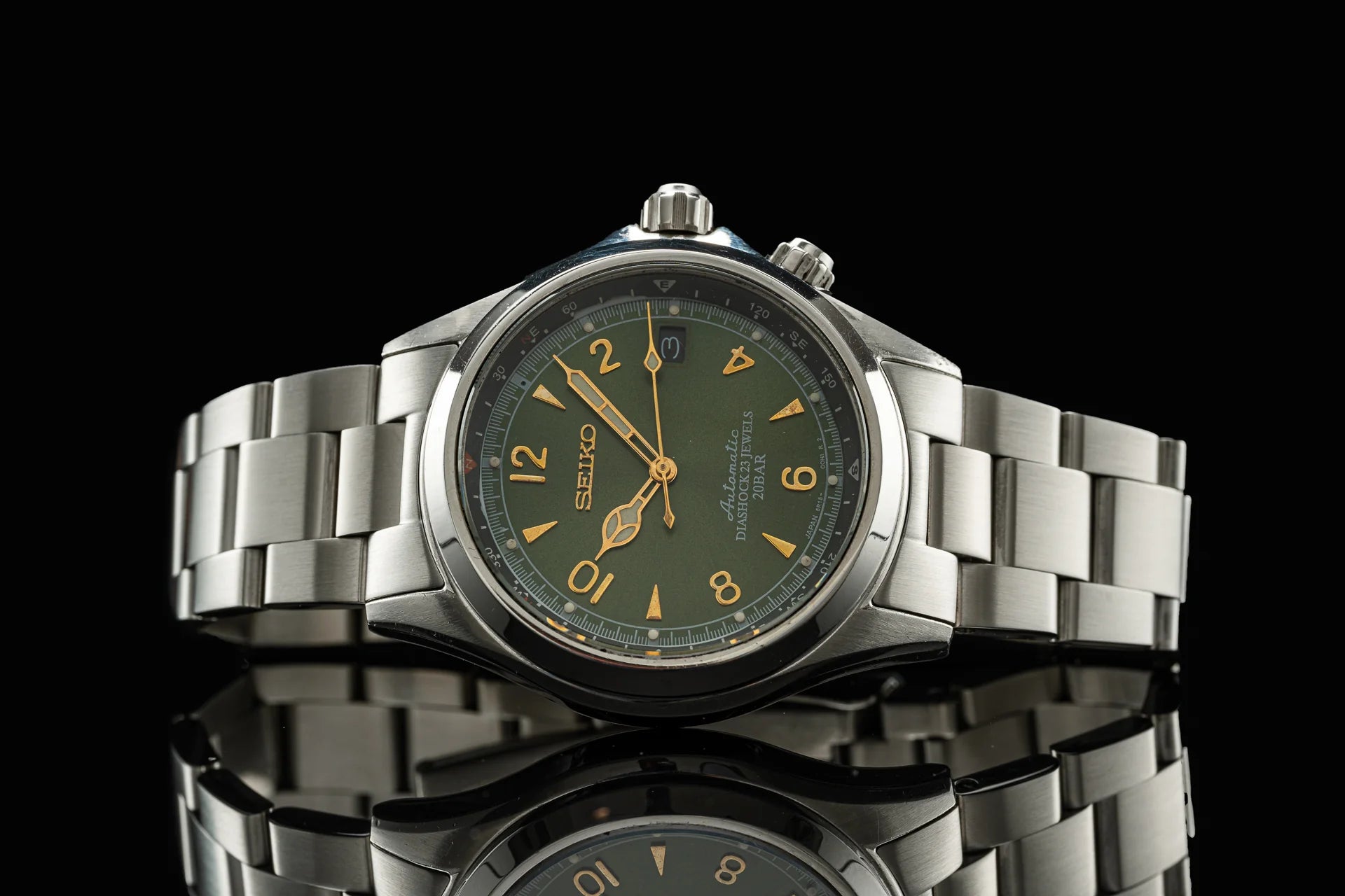 Seiko Alpinist SARB017 stainless steel chronograph watch with olive green dial and gold numerals on metal bracelet