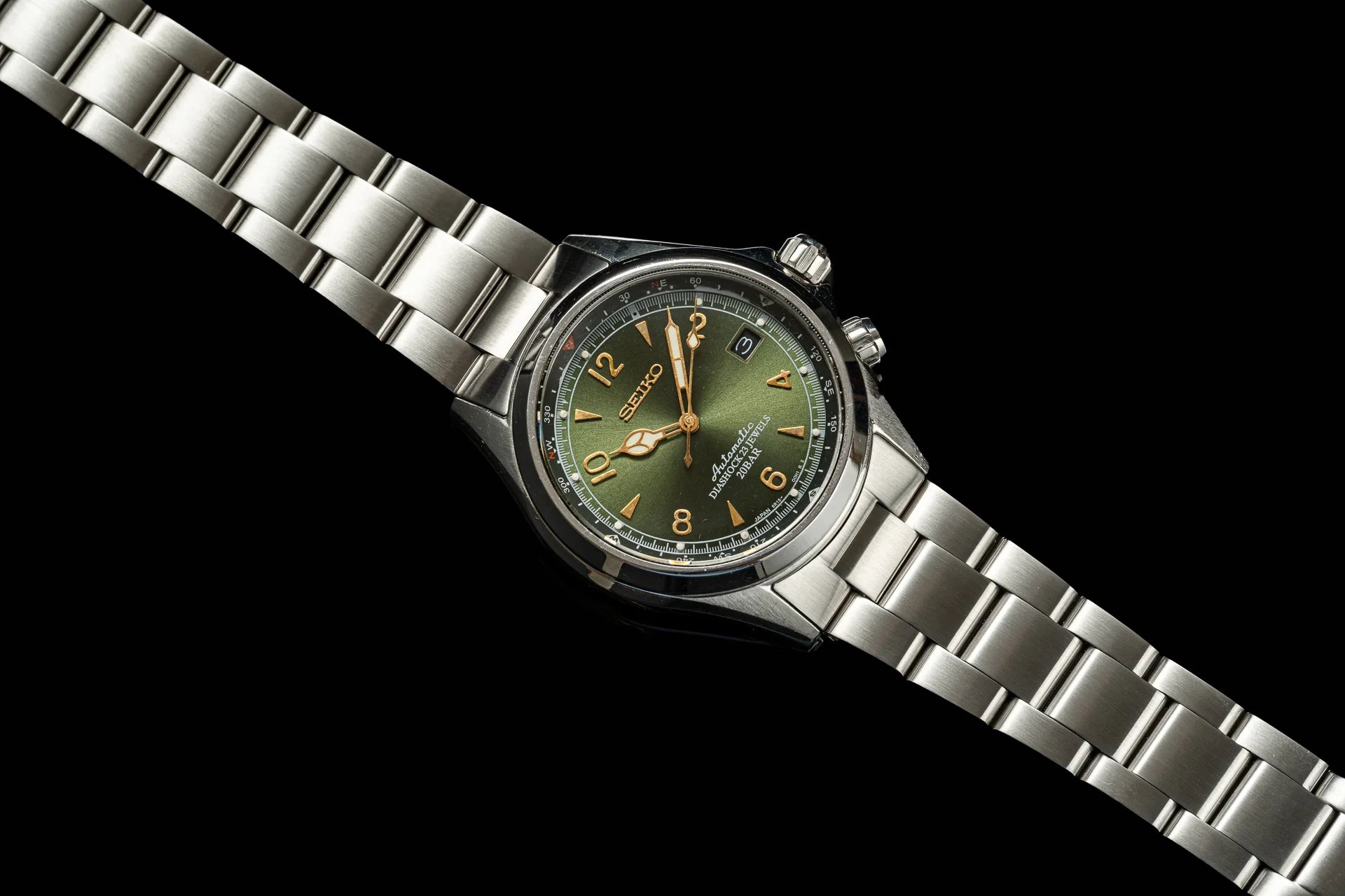 Seiko SARB017 men's watch with green dial, Arabic numerals, stainless steel bracelet, and chronograph subdials