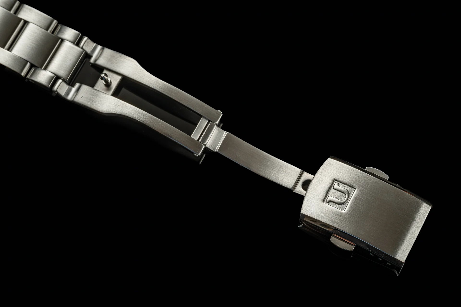 Stainless steel Uncle Senator bracelet for Seiko SARB017 watch with solid links and deployable clasp on black background