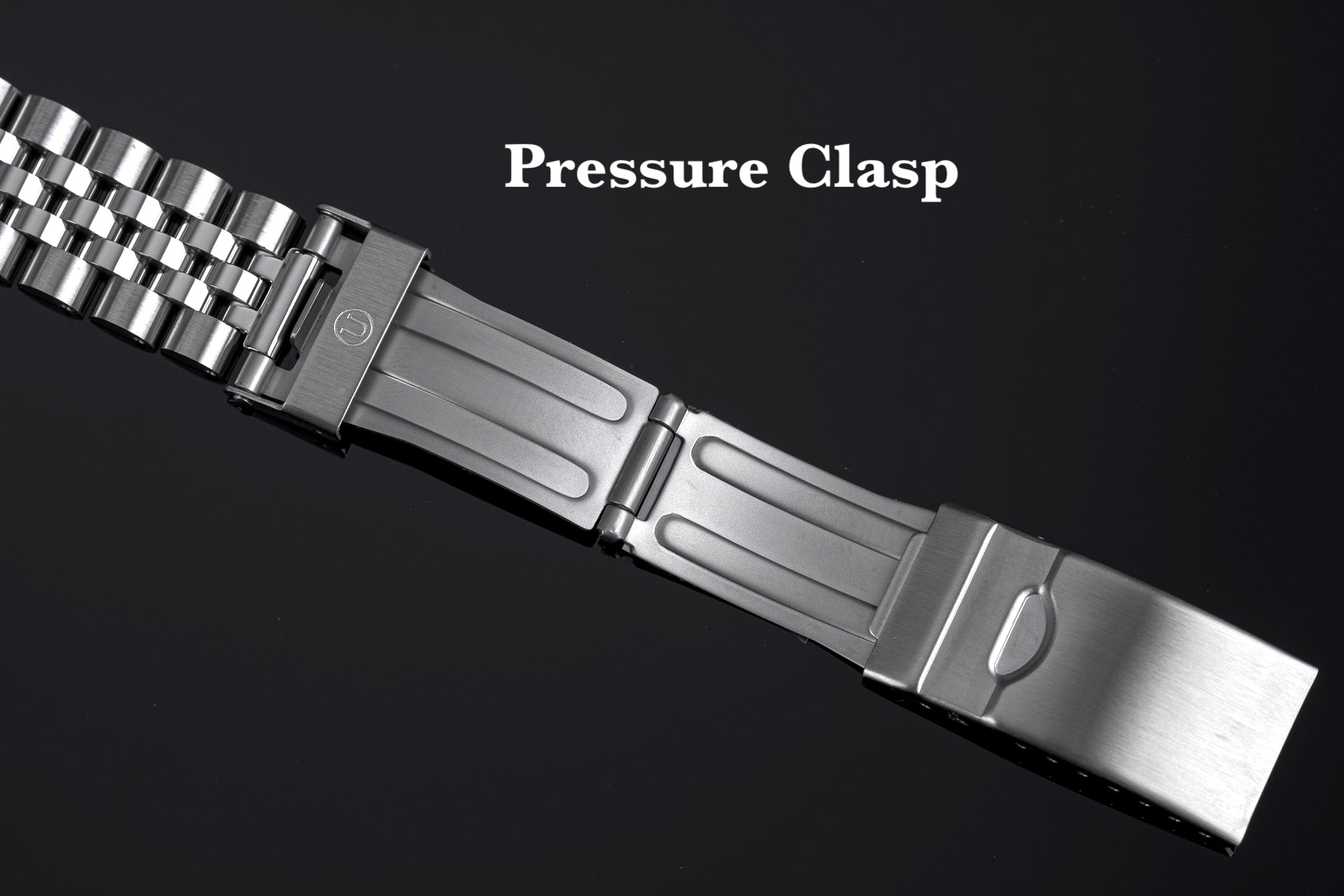 Stainless steel pressure clasp watch band with metal bracelet and secure buckle fastener on black background