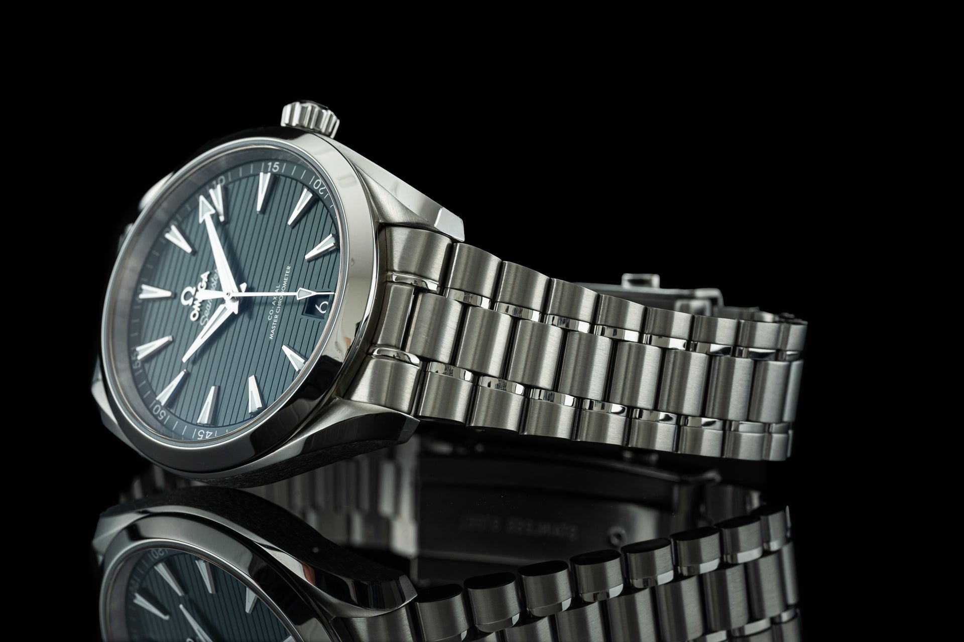 Stainless steel Omega Aqua Terra 41mm watch with blue dial and matching bracelet on black background