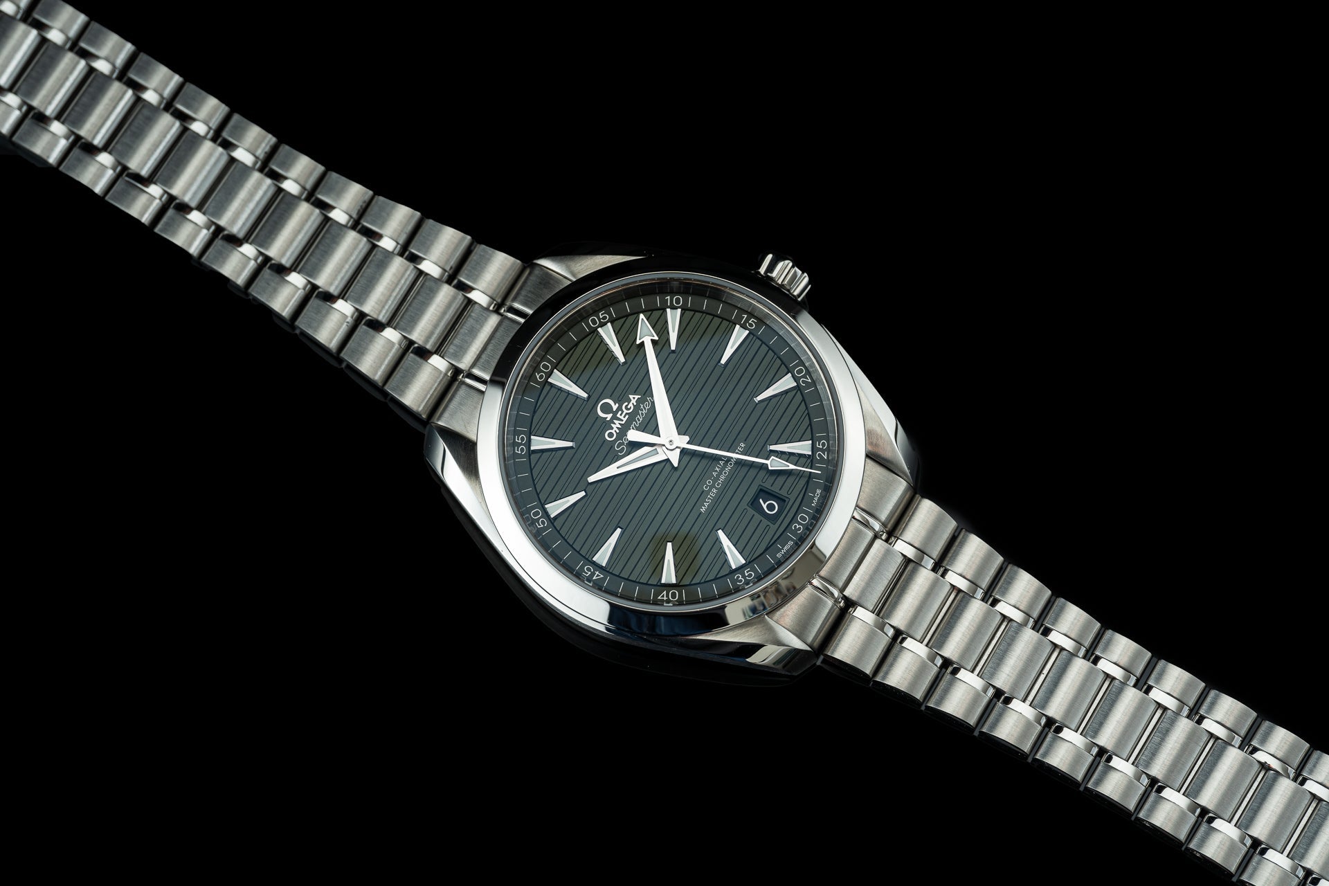 Omega Aqua Terra 41mm automatic watch with stainless steel bracelet and black dial on black background